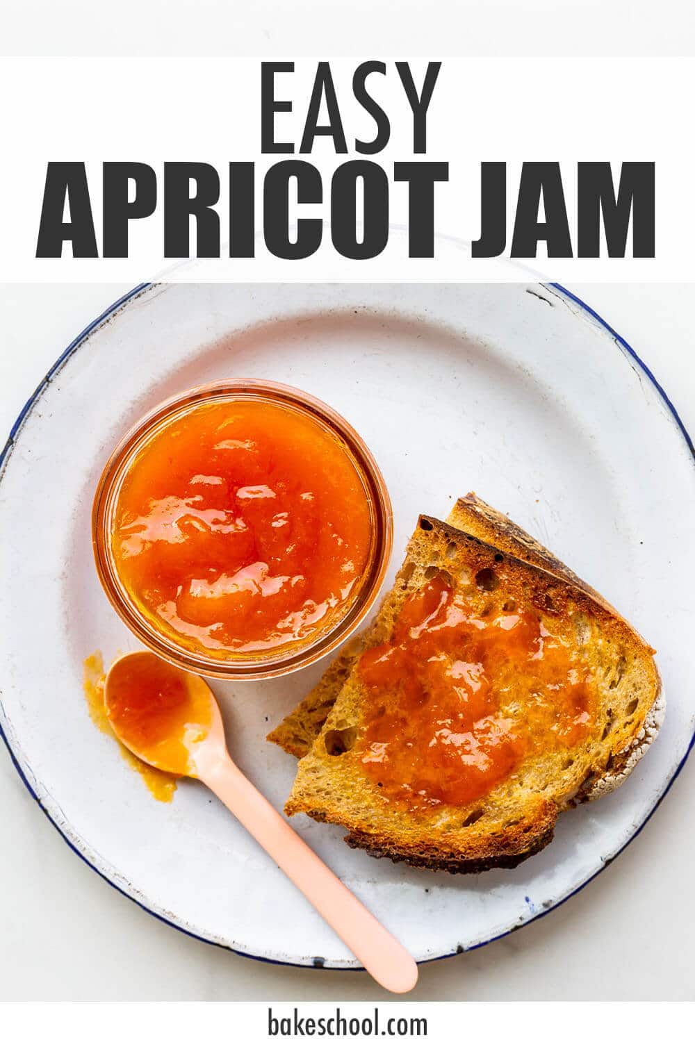 A jar of apricot jam served with toast on a plate.