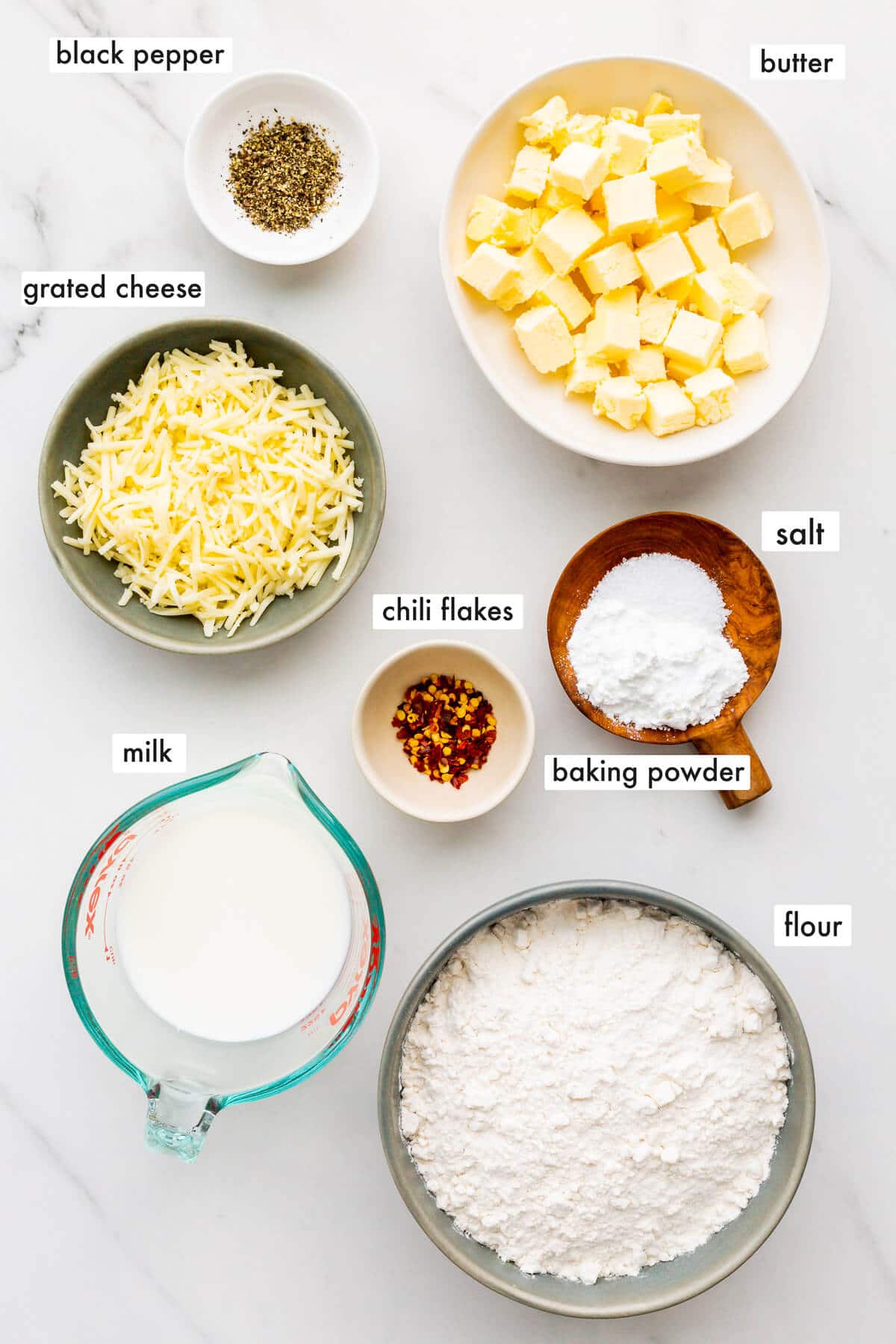 Ingredients to make scones with cheese, measured and ready to be mixed.