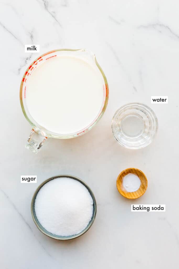 Ingredients to make homemade dulce de leche from scratch, also called milk jam.