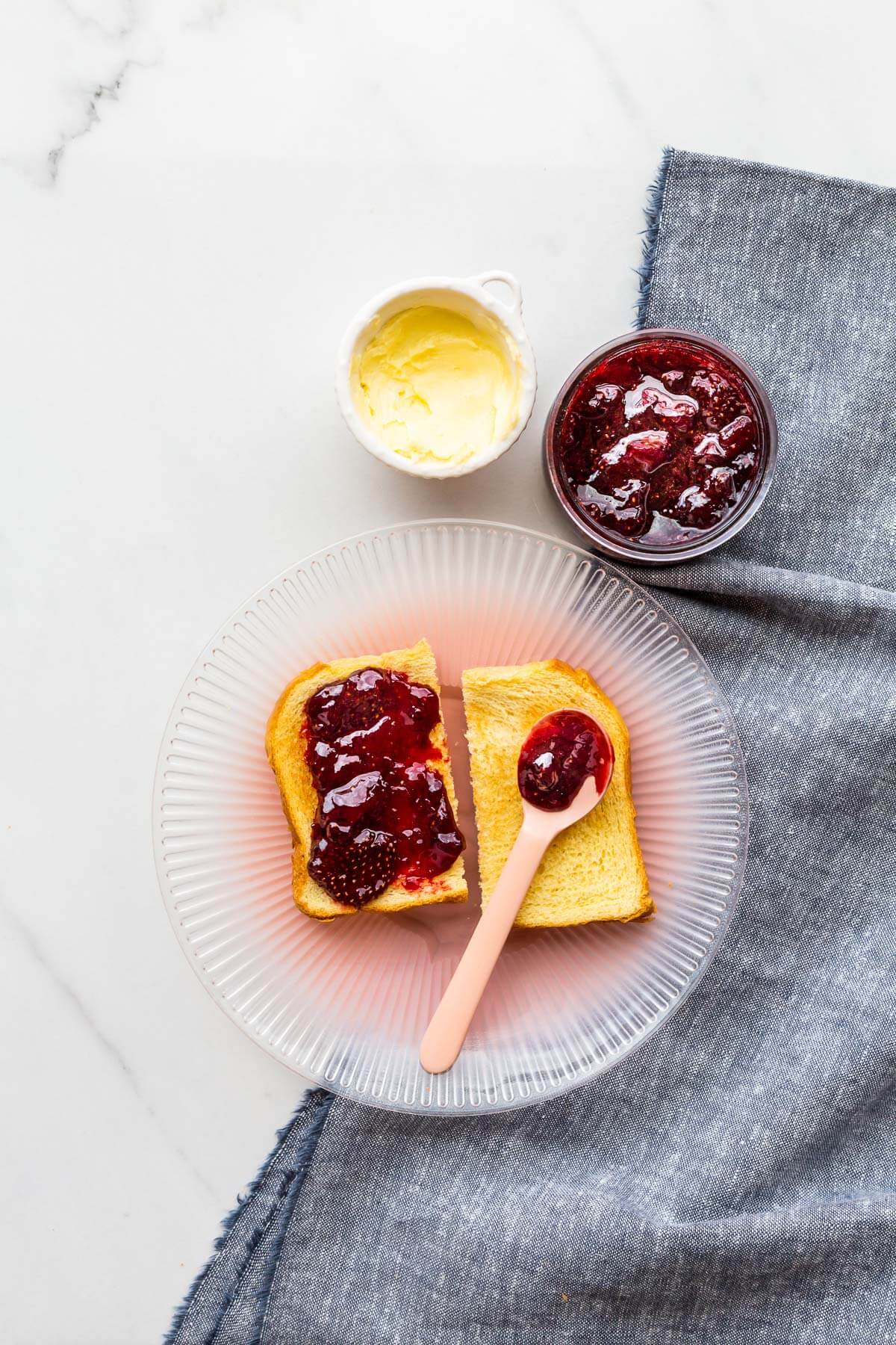 Strawberry jam served with brioche toast and butter.