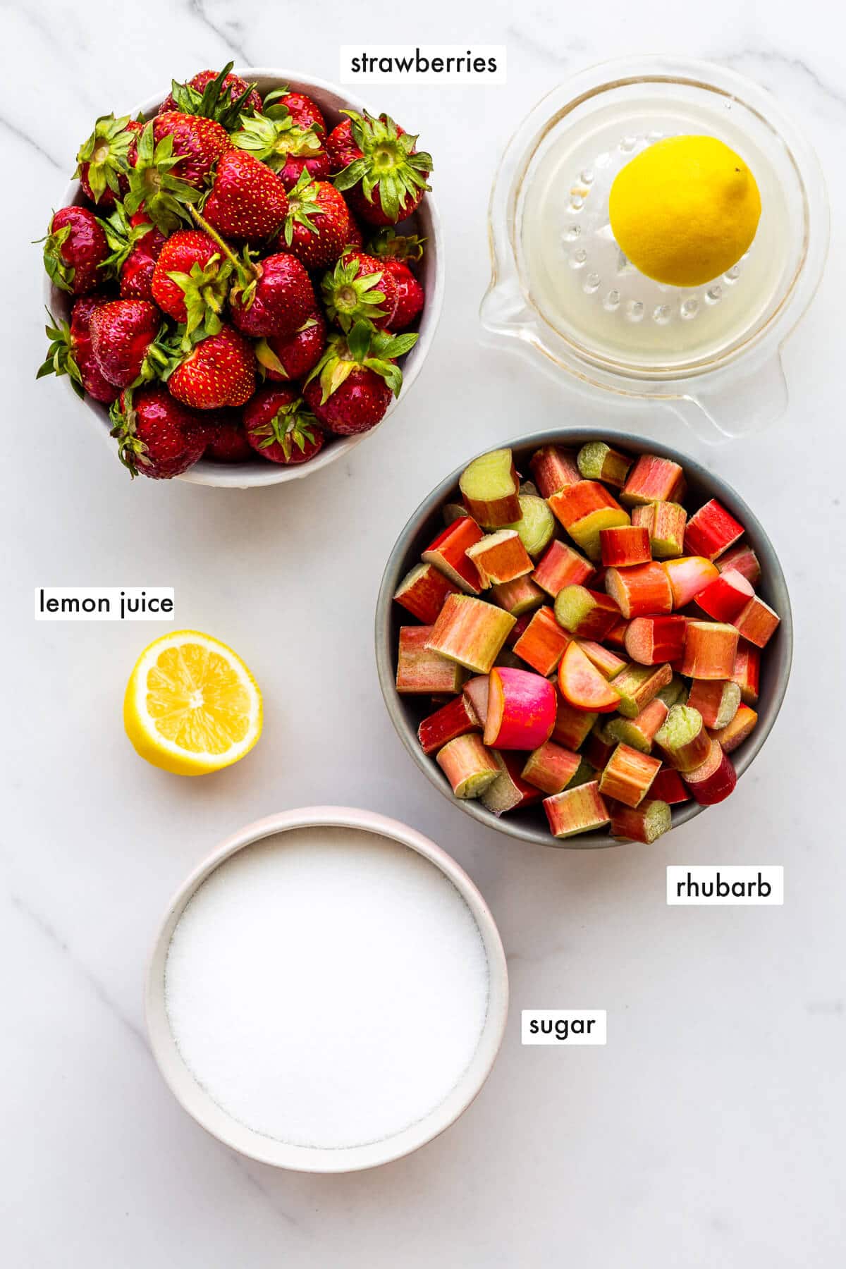 Ingredients to make a small batch of strawberry jam with rhubarb without pectin include strawberries, rhubarb, sugar, and lemon juice.