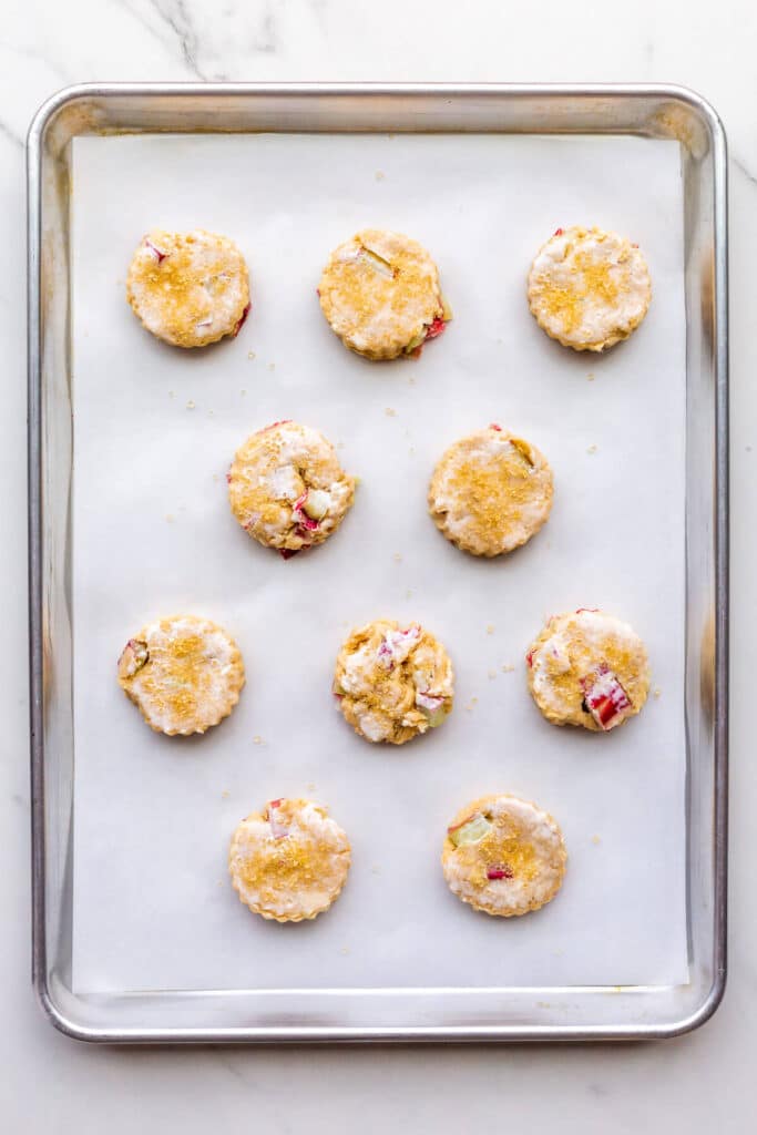 A sheet pan of scones with rhubarb ready to be baked.