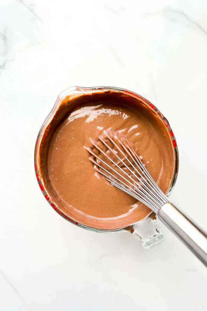 Chilled chocolate custard to make homemade chocolate ice cream, ready to be churned in an ice cream maker.