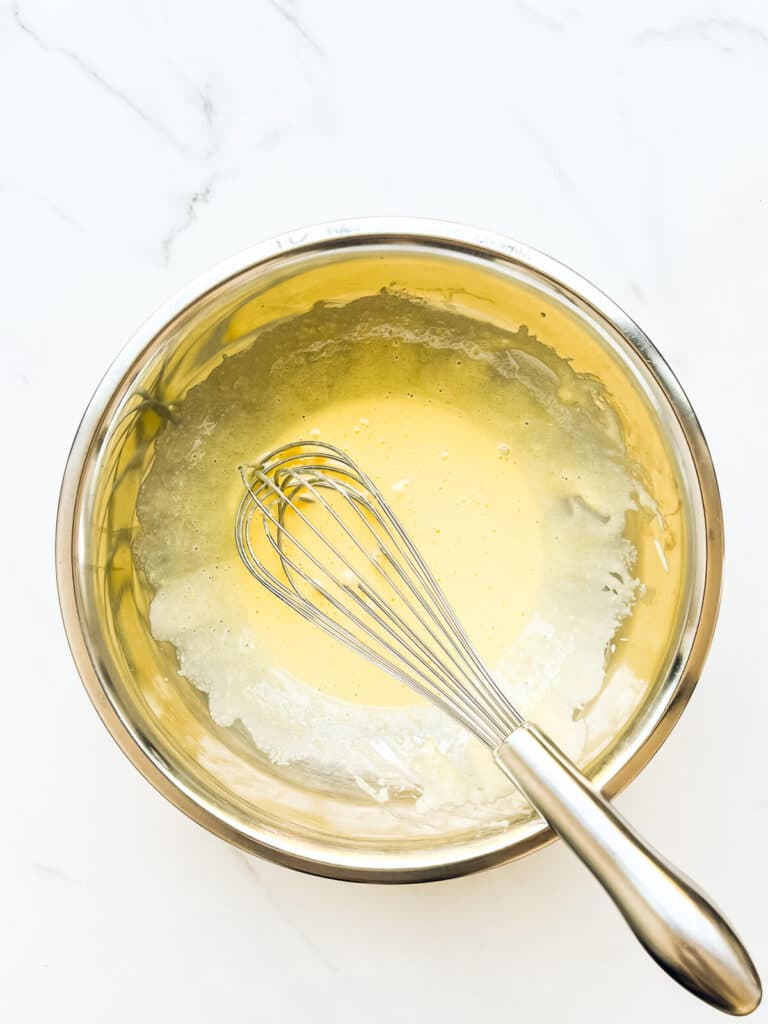 Egg yolks whipped with sugar until light in colour with a whisk.