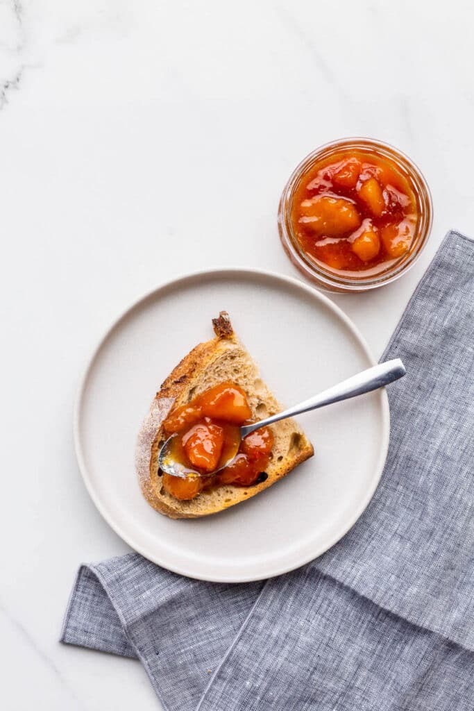 Peach jam served with sourdough bread.