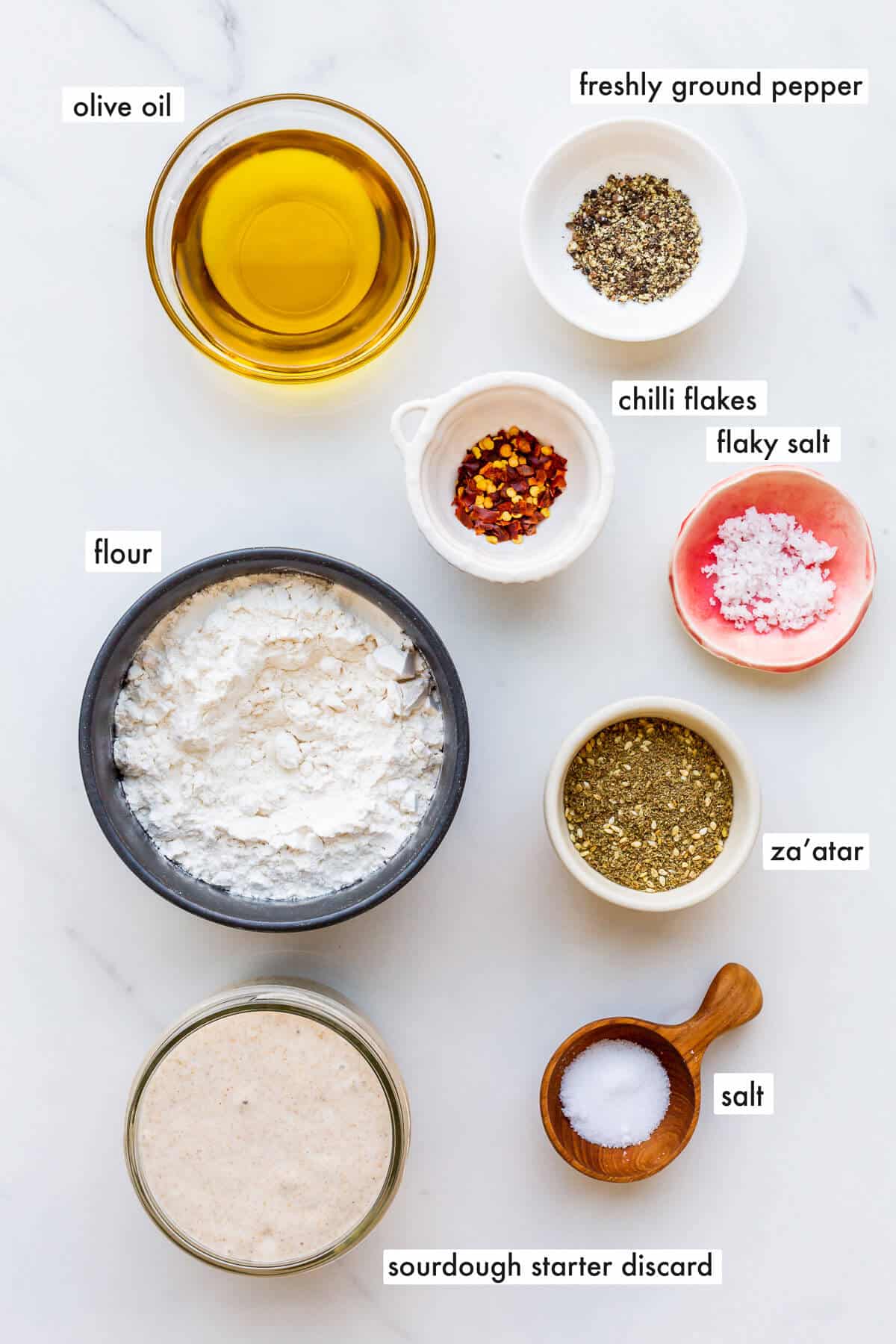 Ingredients to make sourdough discard crackers with olive oil, measured out and ready to make the dough.