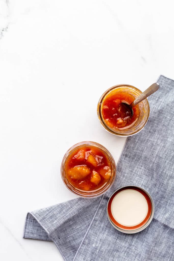 Jars of homemade peach jam.