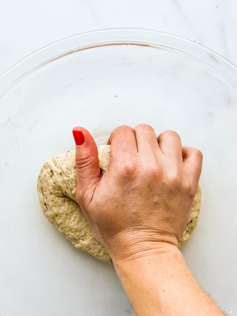 Kneading dough to make crackers.