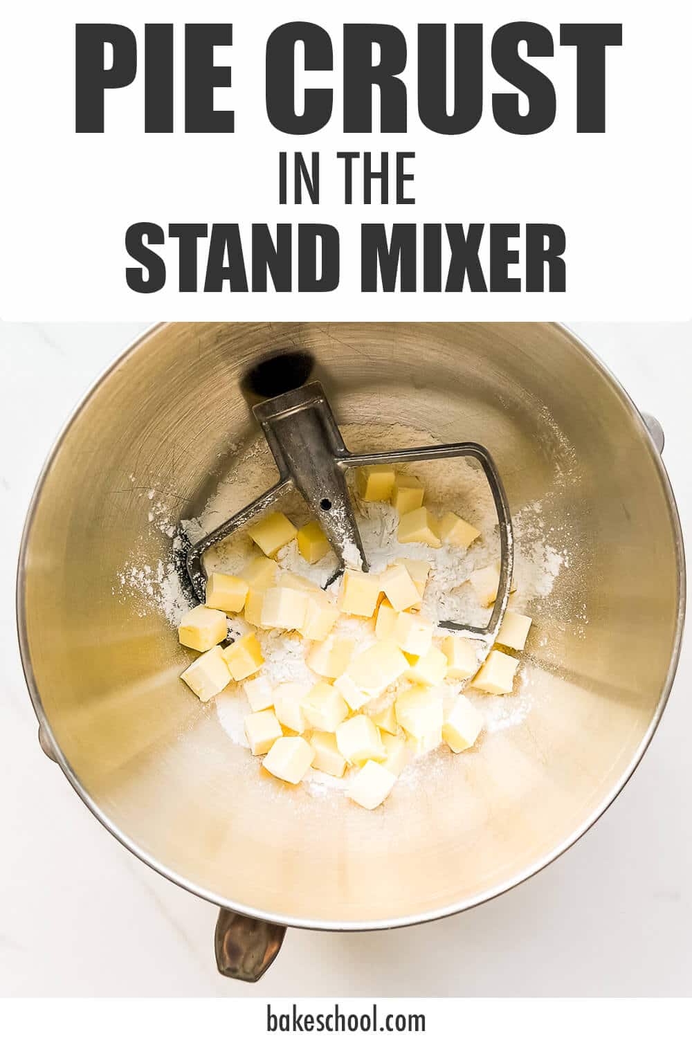 Cubes of cold butter over dry ingredients in stand mixer bowl with paddle attachment to make pie crust.