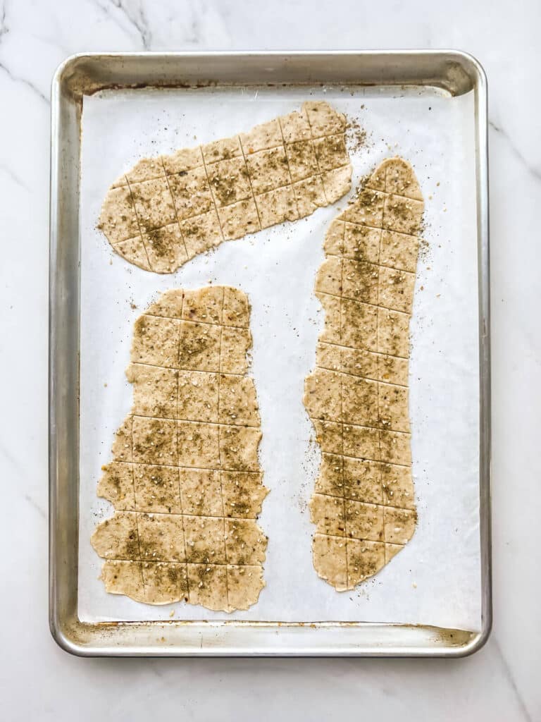 Sourdough discard crackers before baking in the oven.