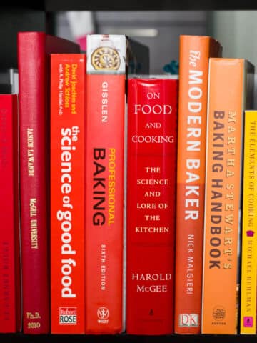 A shelf of baking books in a library.