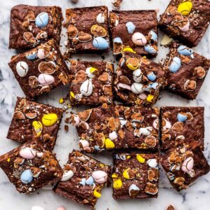 Brownies decorated with Easter eggs cut into squares to serve.