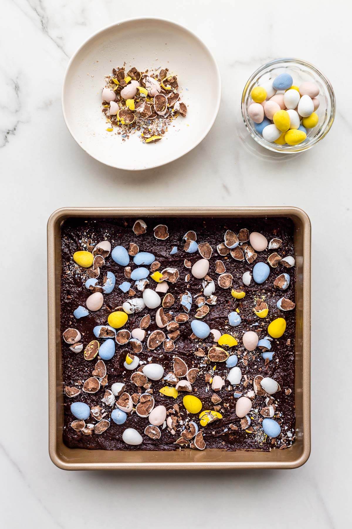 Brownie batter topped with Mini Eggs before baking in the oven.