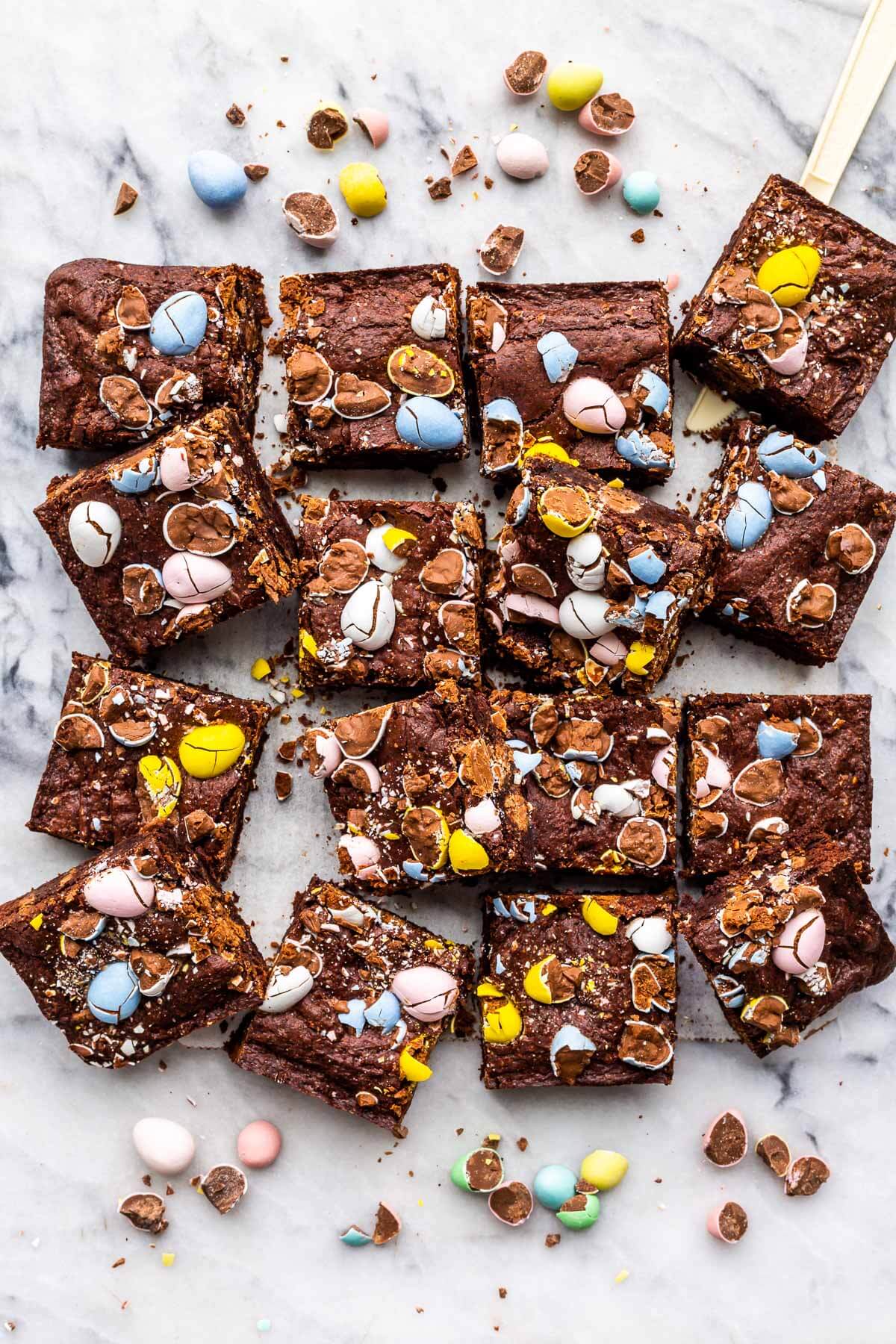 Squares of Easter brownies topped with Mini Eggs.