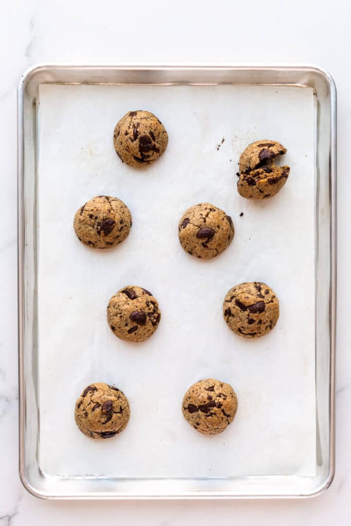 A pan of thick round cookies that didn't spread enough in the oven.