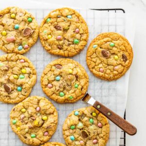 Mini Eggs cookies cooling on a wire rack.