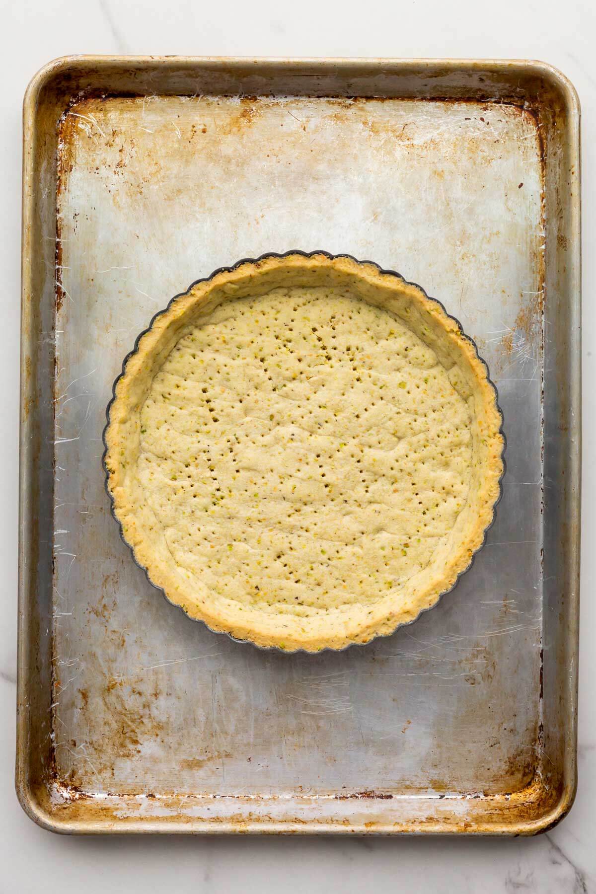 Blind-baked pistachio tart shell for a pistachio tart.