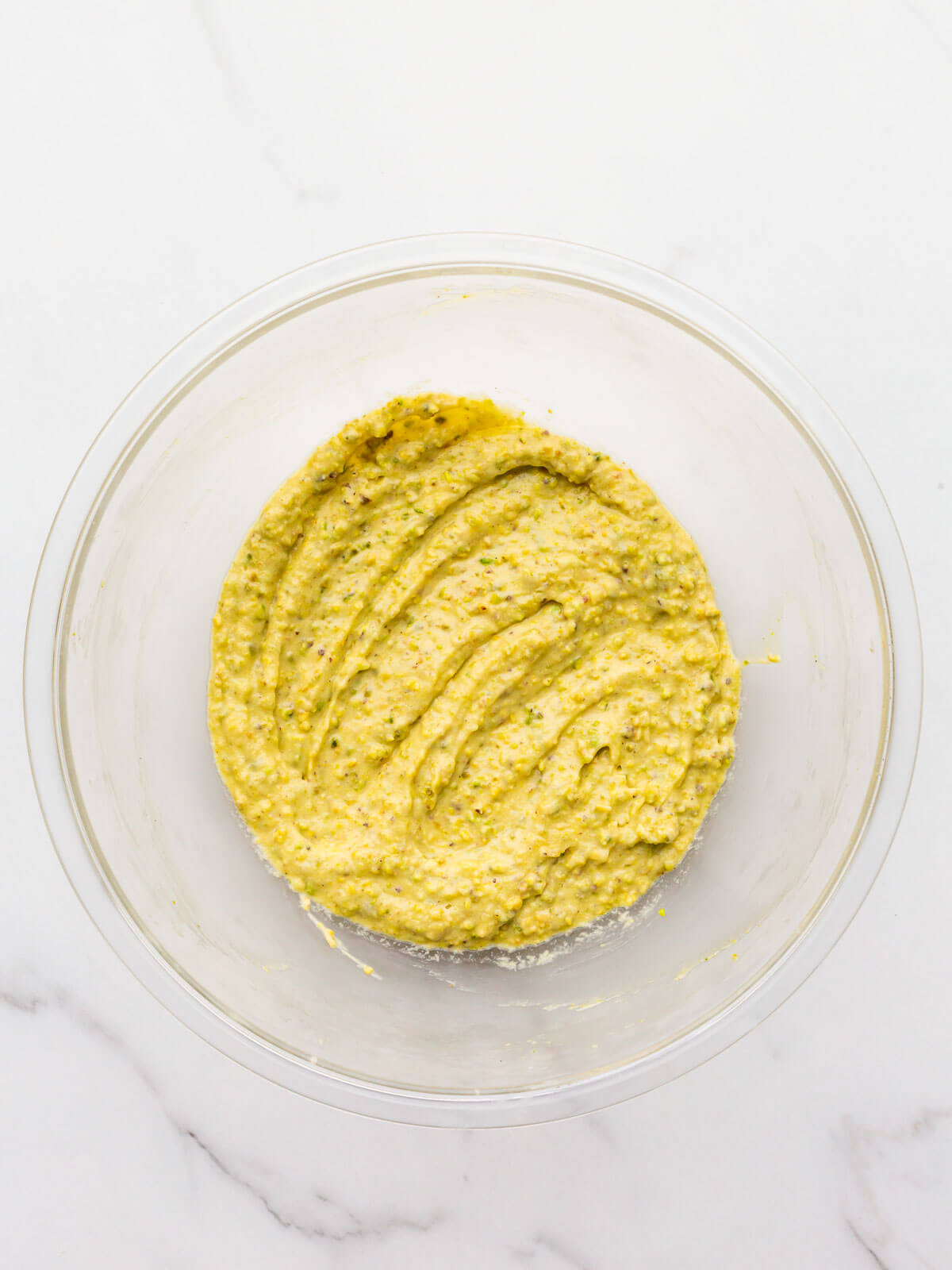 Pistachio cream filling (also called pistachio frangipane) for a tart in a glass bowl.