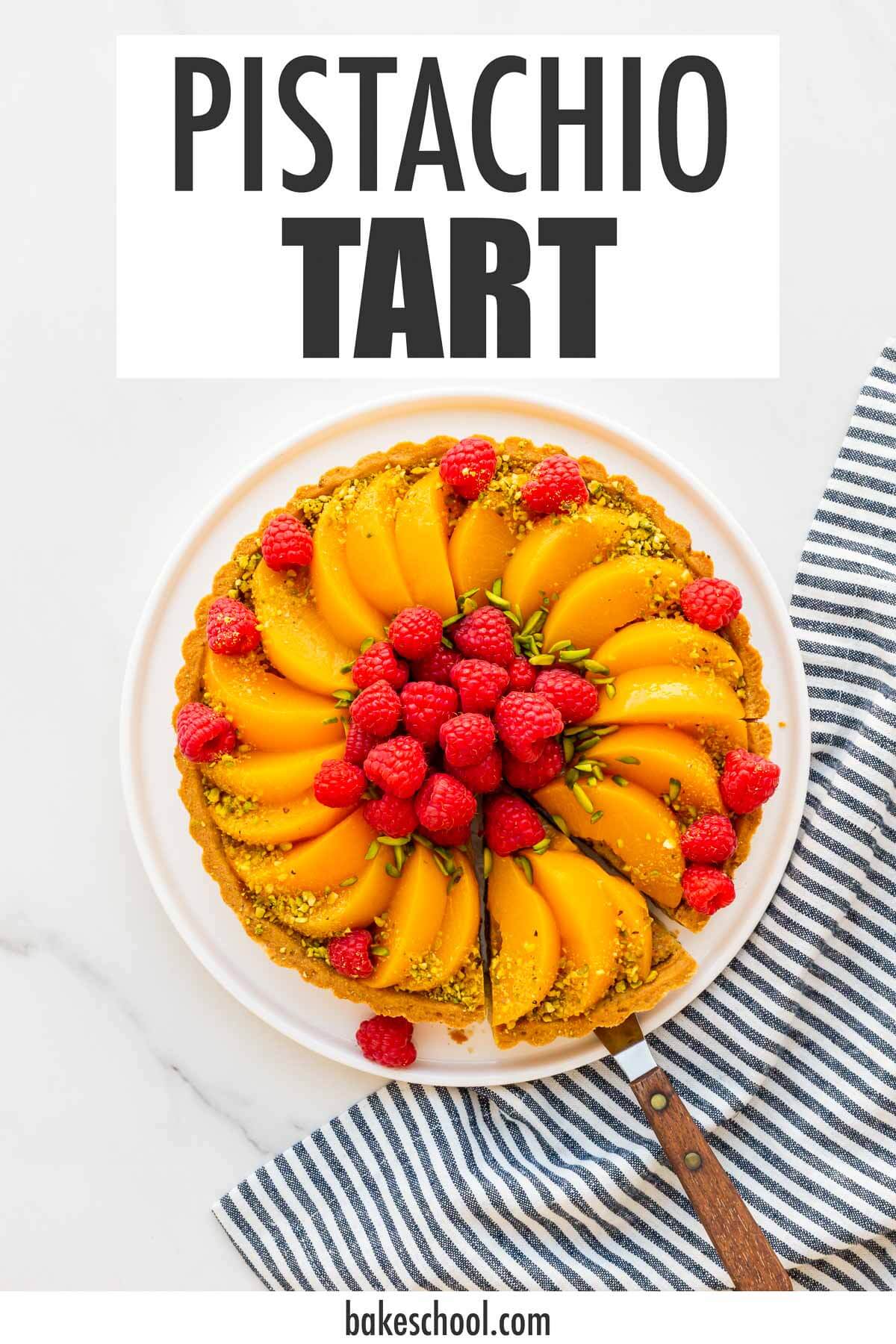 An image of a pistachio tart topped with slices of peaches and raspberries being served. Text overlay says "Pistachio tart".