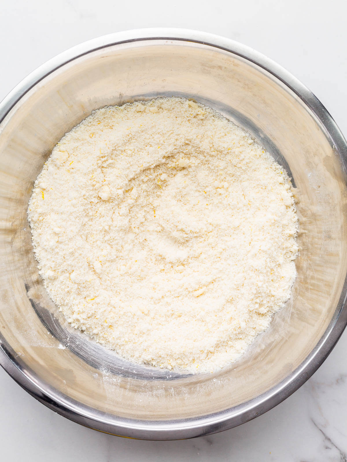 A coarse mixture of flour, sugar, leavening agents, and butter for the reverse creaming method.
