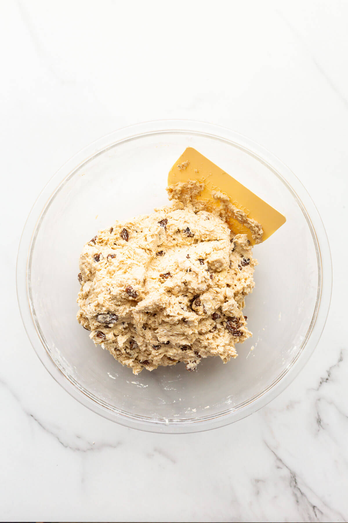 Dough for soda bread with raisins and oats after mixing.