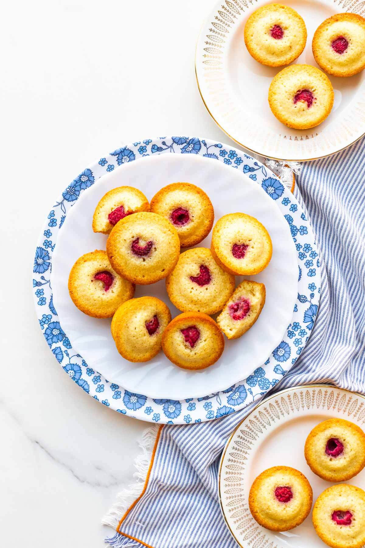 Serving raspberry financiers on small dessert plates.