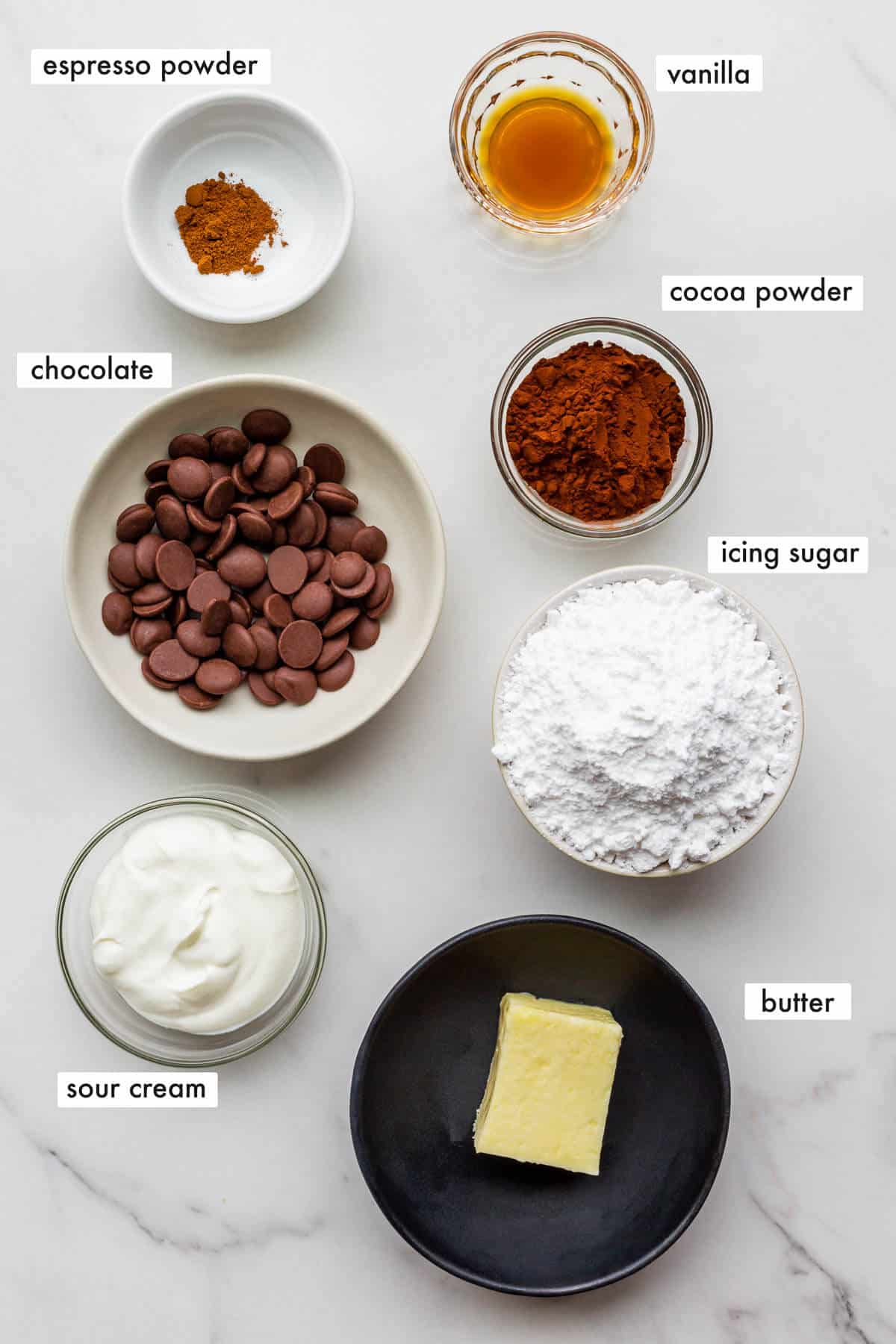 Ingredients to make chocolate fudge frosting with sour cream.