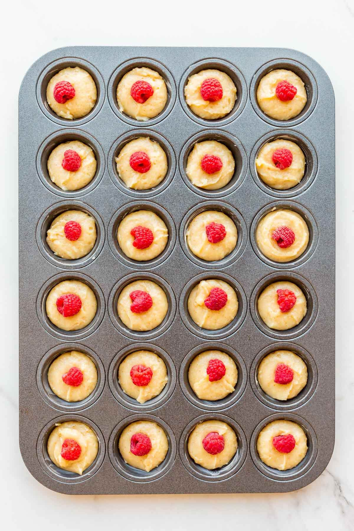 Raspberry almond financiers before baking