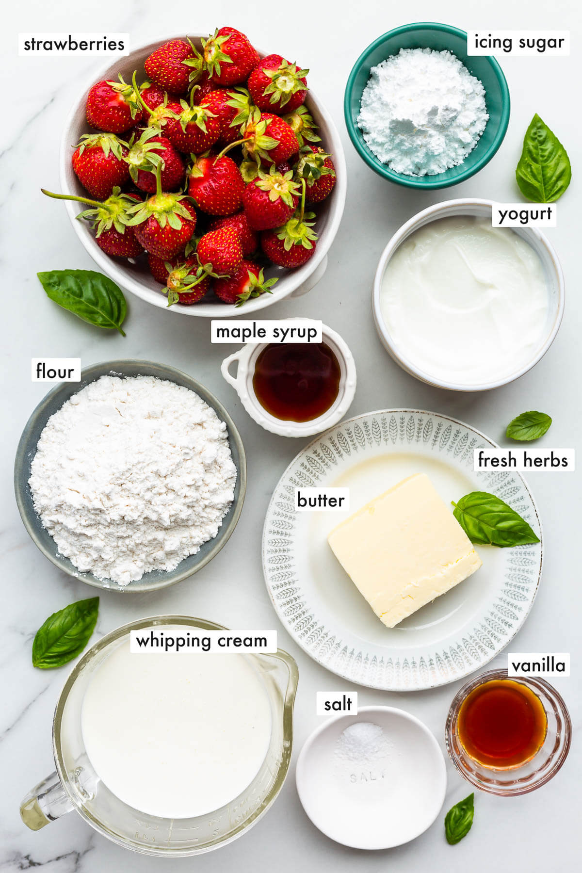 Ingredients to make a strawberry tart with whipped cream and a shortbread cookie crust.