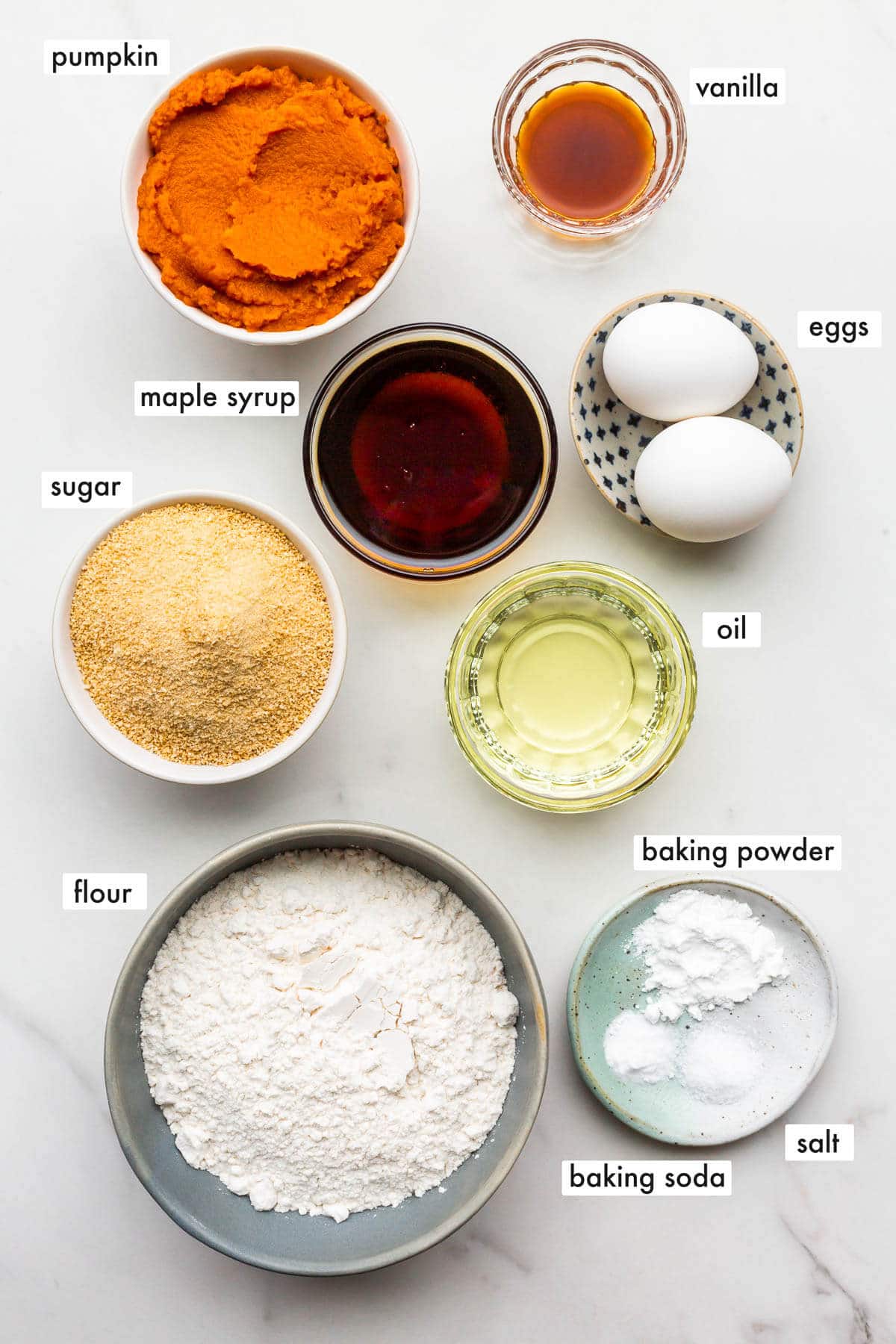 Ingredients to make pumpkin bread with maple syrup and maple sugar.