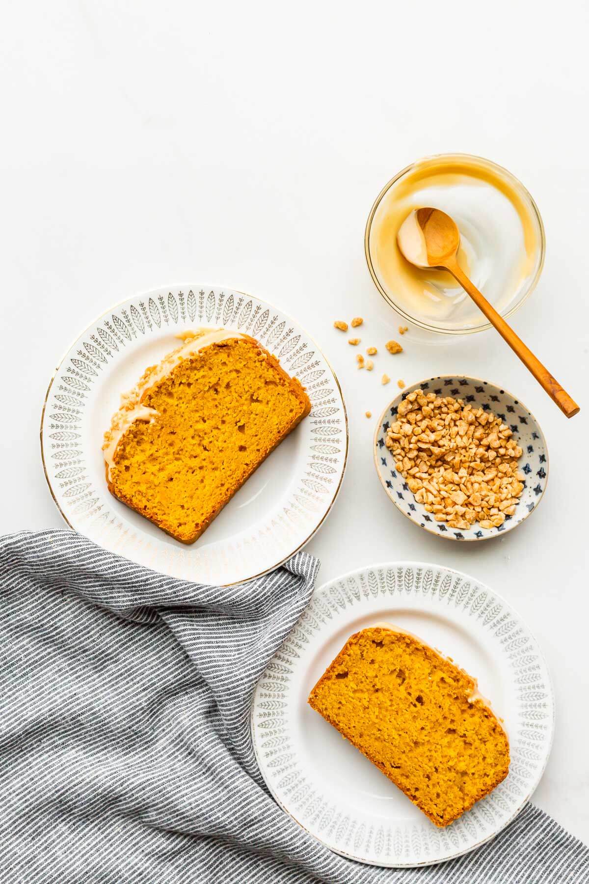 Slices of pumpkin bread on dessert plates.