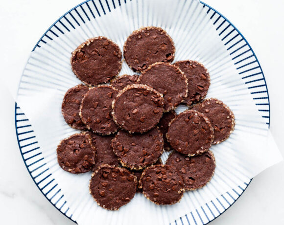 A plate of double chocolate cookies with a crunchy sugar edge.