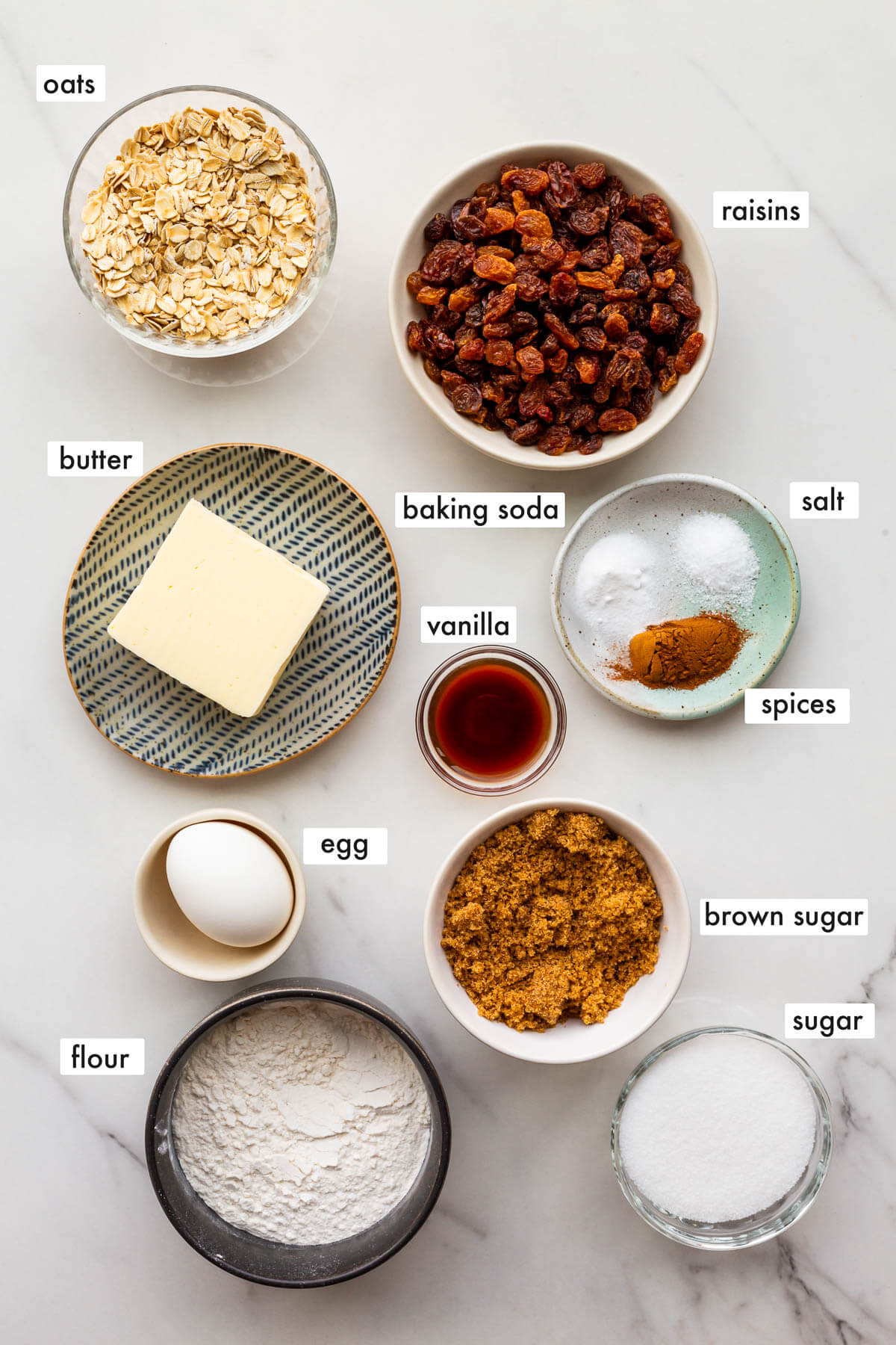 Ingredients to make oatmeal raisin cookies from scratch.