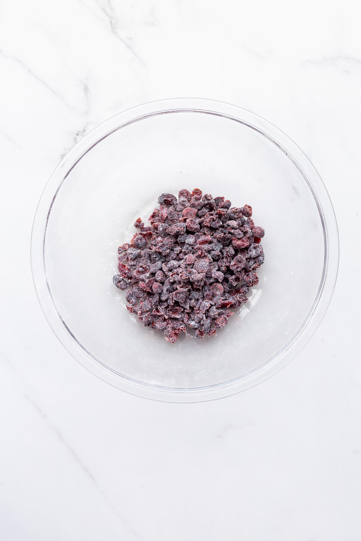 Dried cranberries coated in flour before incorporating into a pumpkin cake batter.