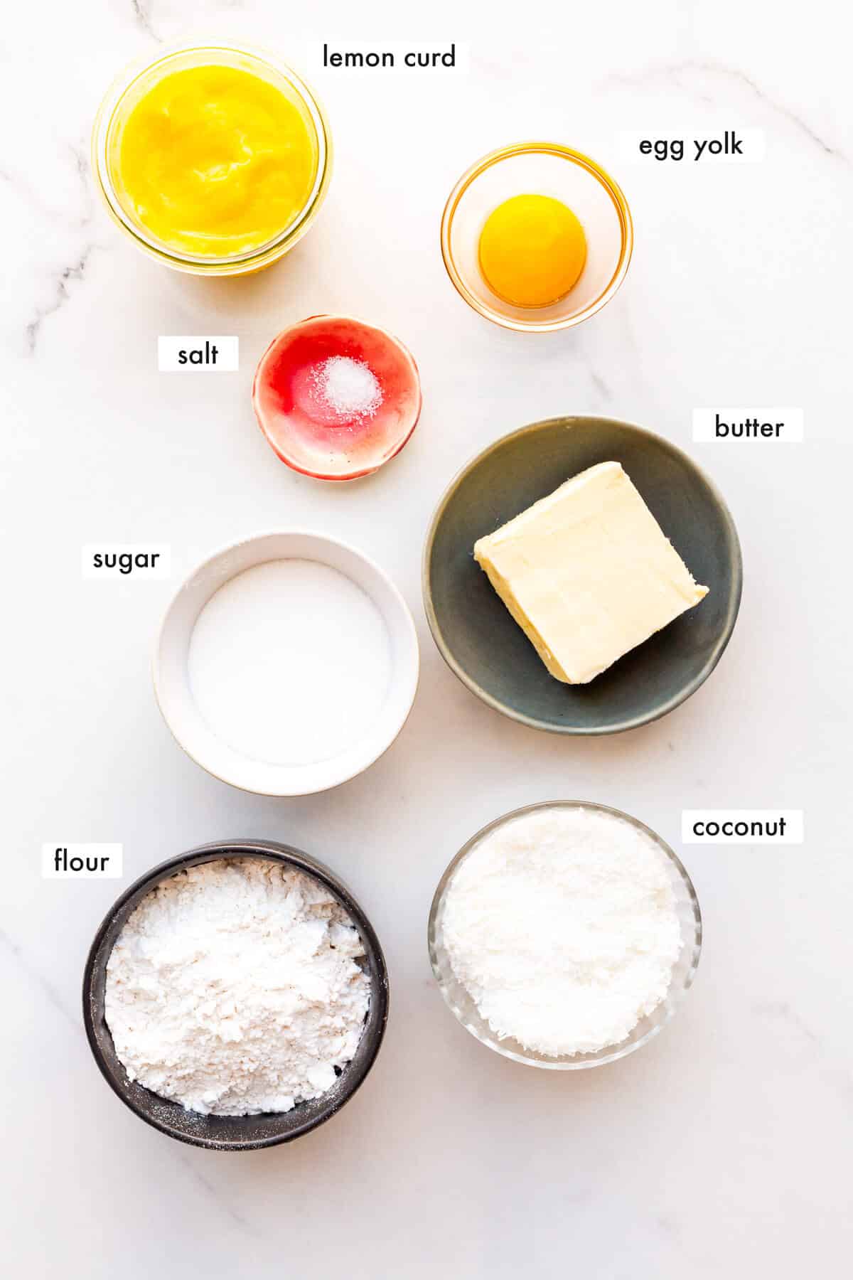 Ingredients to make coconut shortbread cookies with a lemon curd filling measured out.