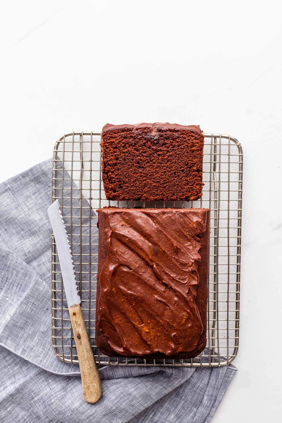 Chocolate pound cake being sliced to serve it.