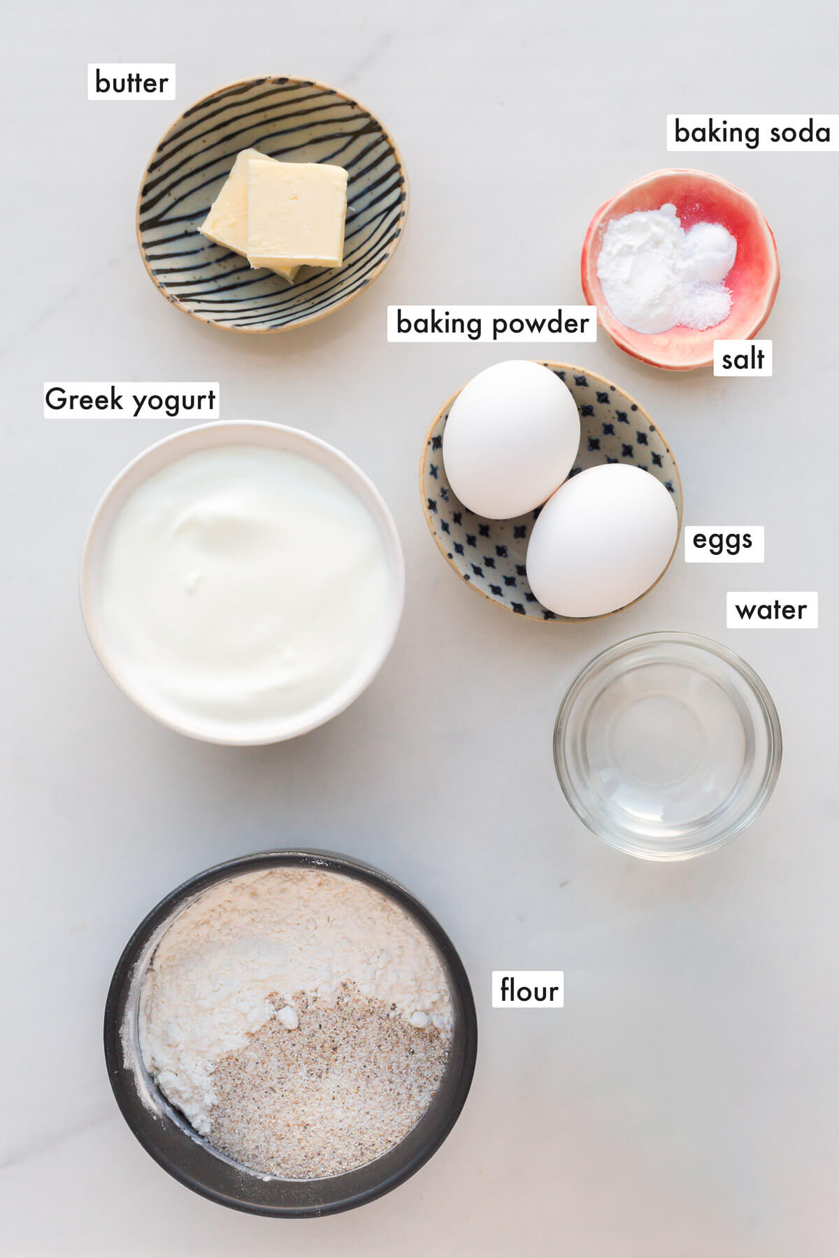 Ingredients to make higher protein pancakes measured out (including ingredients like eggs and Greek yogurt).