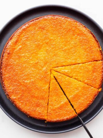 Slicing and serving a glazed orange cake