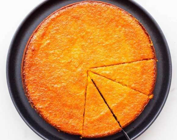 Slicing and serving a glazed orange cake