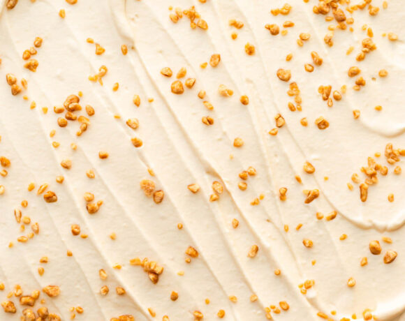 Swirls of maple-flavoured whipped cream with maple flakes sprinkled on top.