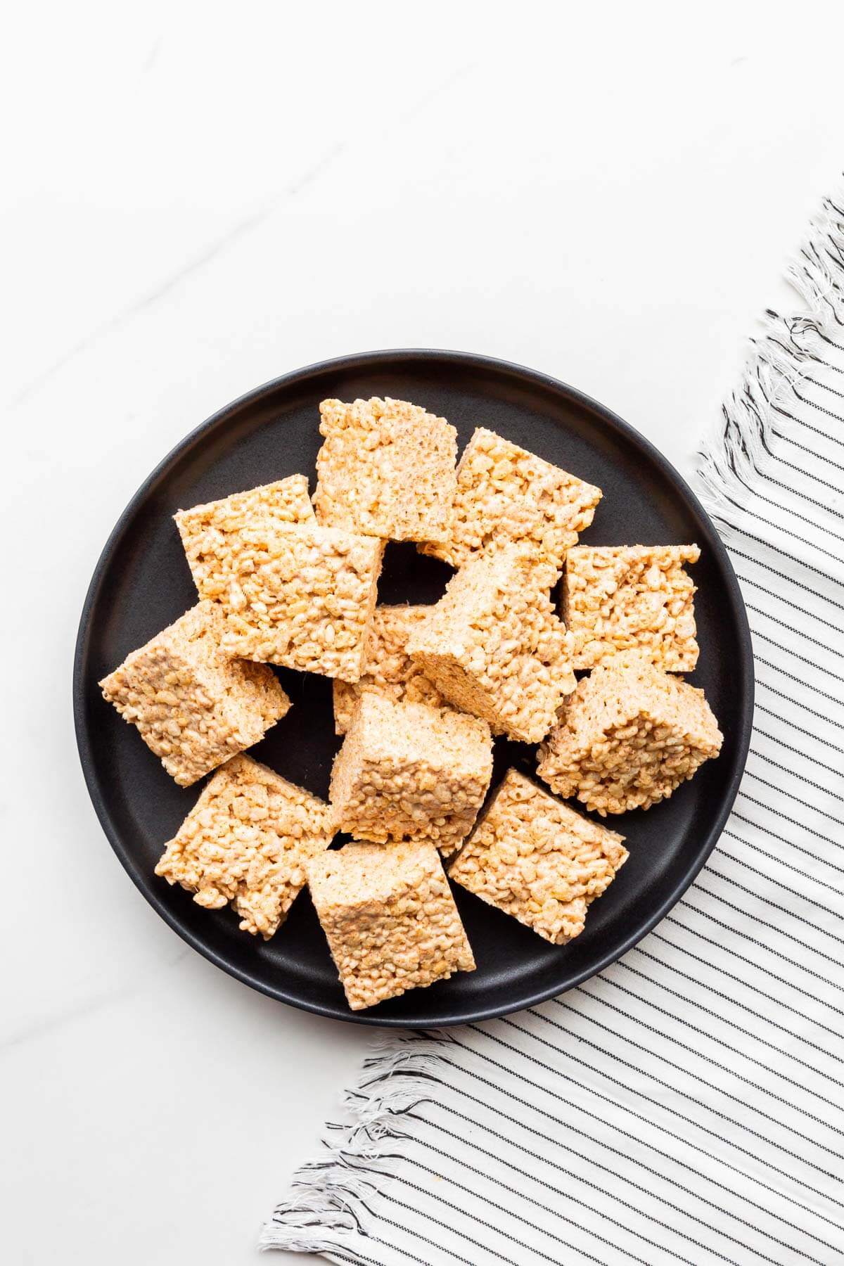 A plate of homemade Rice Krispies squares.