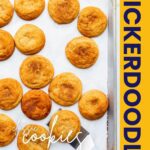 Freshly-baked snickerdoodle cookies on a sheet pan, ready to be served.