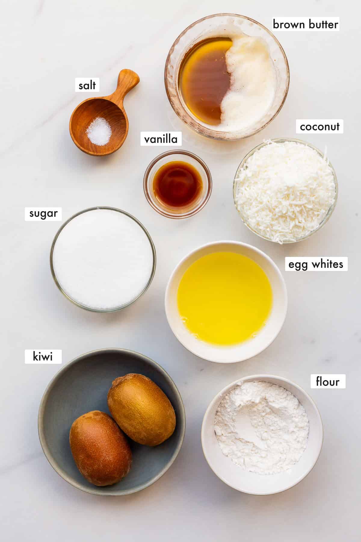 Ingredients to make coconut financiers topped with golden kiwi fruit, all measured out and ready to be mixed.