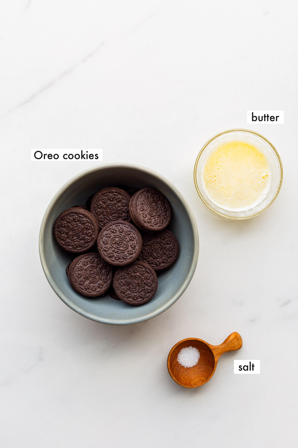 Ingredients to make an Oreo cookie crust from whole Oreos instead of discontinued chocolate wafers, as well as melted butter and salt.
