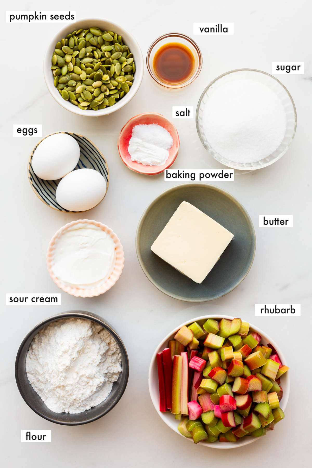 Ingredients to make a pumpkin seed cake with rhubarb measured out and ready to be mixed.