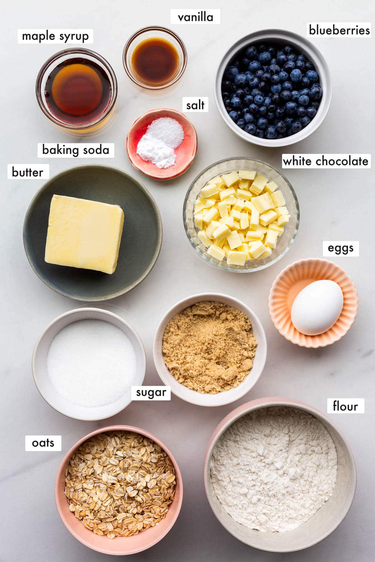 Ingredients to make oatmeal blueberry cookies with white chocolate measured out and ready to be mixed.