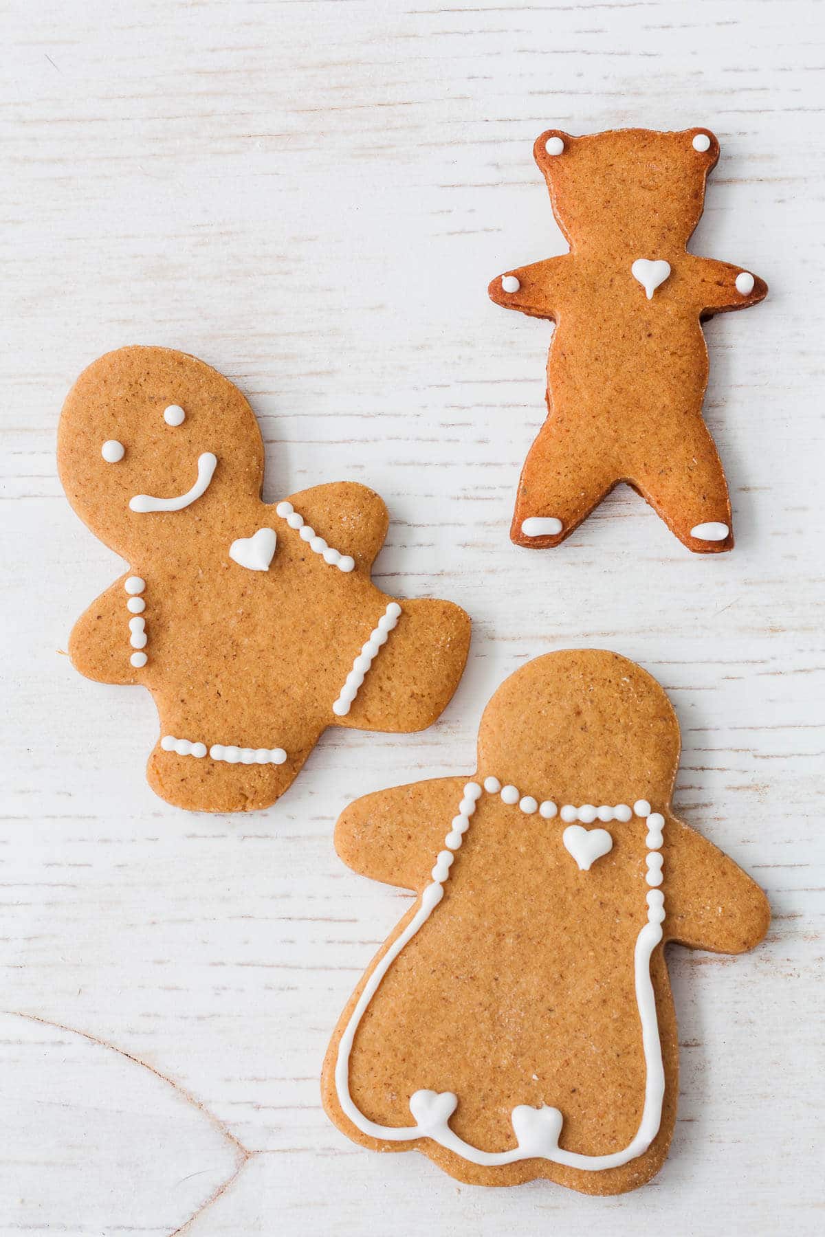 Cutout gingerbread cookies decorated with royal icing.