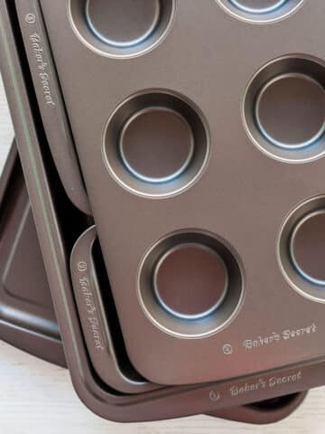 A stack of Baker's Secret non-stick bakeware.