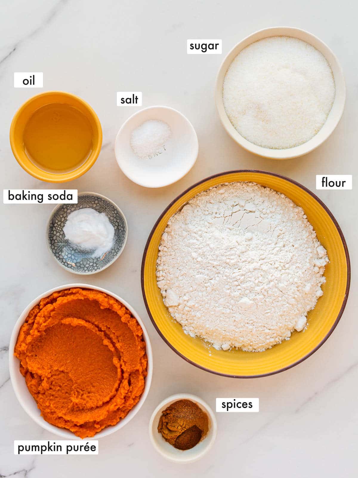 Ingredients to make a healthy pumpkin bread without eggs, lower sugar and low-fat.